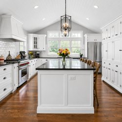 Hence Co - Kitchen renovation with a vaulted ceiling, white cabinetry and a spacious island by Hence Co. Design-Build.
