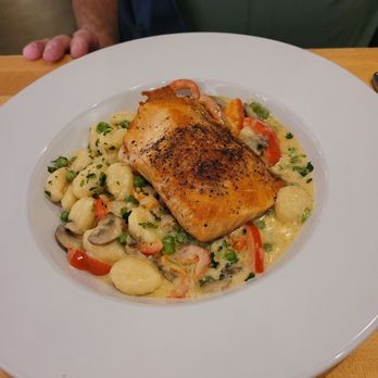 Tavola Trattoria - Gnocchi with salmon and veggies in parmesan cream sauce. - Italian Near Me - Bentonville, Arkansas Tavola Trattoria - Gnocchi with salmon and veggies in parmesan cream sauce. - Italian Near Me - Bentonville, Arkansas