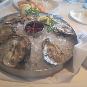 Chart House - RAW OYSTERS: Seven oysters on a half shell. Served with a balsamic sauce to add. - Seafood Near Me - Melbourne, Florida