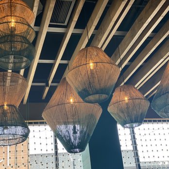 Nando's Peri-Peri - Super cool lighting. All the decor comes from Africa - South African Near Me - Oakbrook, Illinois Nando's Peri-Peri - Super cool lighting. All the decor comes from Africa - South African Near Me - Oakbrook, Illinois