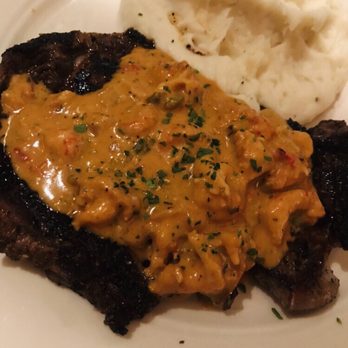 Grace's - BAYOU SURF & TURF 9 oz blackened ribeye with crawfish cream sauce served with mashed potatoes - American Near Me - Houston, Texas Grace's - BAYOU SURF & TURF 9 oz blackened ribeye with crawfish cream sauce served with mashed potatoes - American Near Me - Houston, Texas