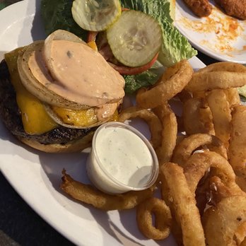 Sully's Bar and Grill - Monster burger w/onion rings - Bars Near Me - Rocklin, California Sully's Bar and Grill - Monster burger w/onion rings - Bars Near Me - Rocklin, California