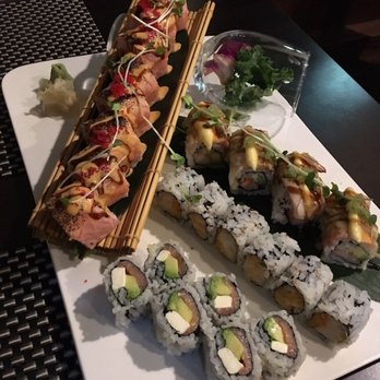 Ichiro Japanese - Clockwise from 9pm- exchange roll, out of control roll, spicy scallop, Philadelphia roll. - Japanese Near Me - Geneva, New York Ichiro Japanese - Clockwise from 9pm- exchange roll, out of control roll, spicy scallop, Philadelphia roll. - Japanese Near Me - Geneva, New York