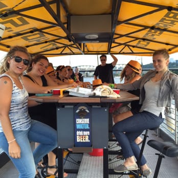 Trolley Pub - Portland - a group of people sitting at a table - Bar Crawl Near Me - Portland, Oregon Trolley Pub - Portland - a group of people sitting at a table - Bar Crawl Near Me - Portland, Oregon