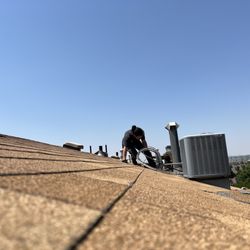 Rocket Plumbing Heating and Air Conditioning - RJ battling both wasps and heat on a very high roof.