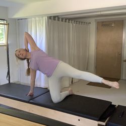 Virta Pilates - Virta Pilates offers virtual mat classes every Thursday at 5:30 pm. Owner Beth is demonstrating kneeling side kicks.