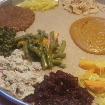 Elfegne Ethiopian Cuisine - Veggie Platter, Tegabino shiro (right) - Ethiopian Near Me - Washington, DC, District of Columbia Elfegne Ethiopian Cuisine - Veggie Platter, Tegabino shiro (right) - Ethiopian Near Me - Washington, DC, District of Columbia
