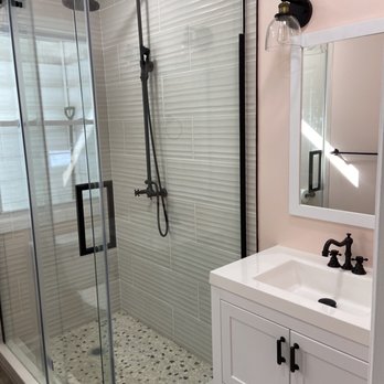 Alpha Renovations - a bathroom with a shower and sink - General Contractors Near Me - Clifton, New Jersey