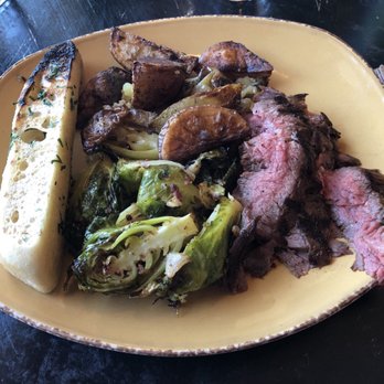 Urban Plates - Chimichurri Grass Fed Steak w/ Bread and Roasted Rosemary Potatoes and Roasted Brussel Sprouts w/ Turkey Bacon as sides - New American Near Me - Dublin, California Urban Plates - Chimichurri Grass Fed Steak w/ Bread and Roasted Rosemary Potatoes and Roasted Brussel Sprouts w/ Turkey Bacon as sides - New American Near Me - Dublin, California