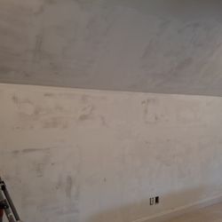 Chris Painting - Wall after Chris Painting still has gouges and exposed cardboard which will warp with priming. Job was not done properly...still not done!!