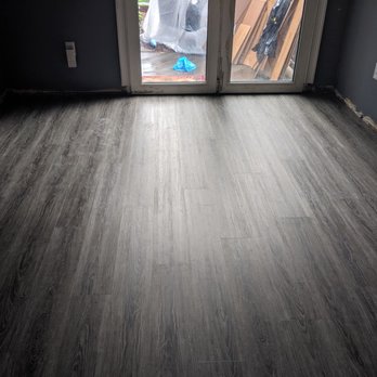 Fetchko Floors - an empty room with a sliding glass door - Flooring Near Me - Finleyville, Pennsylvania