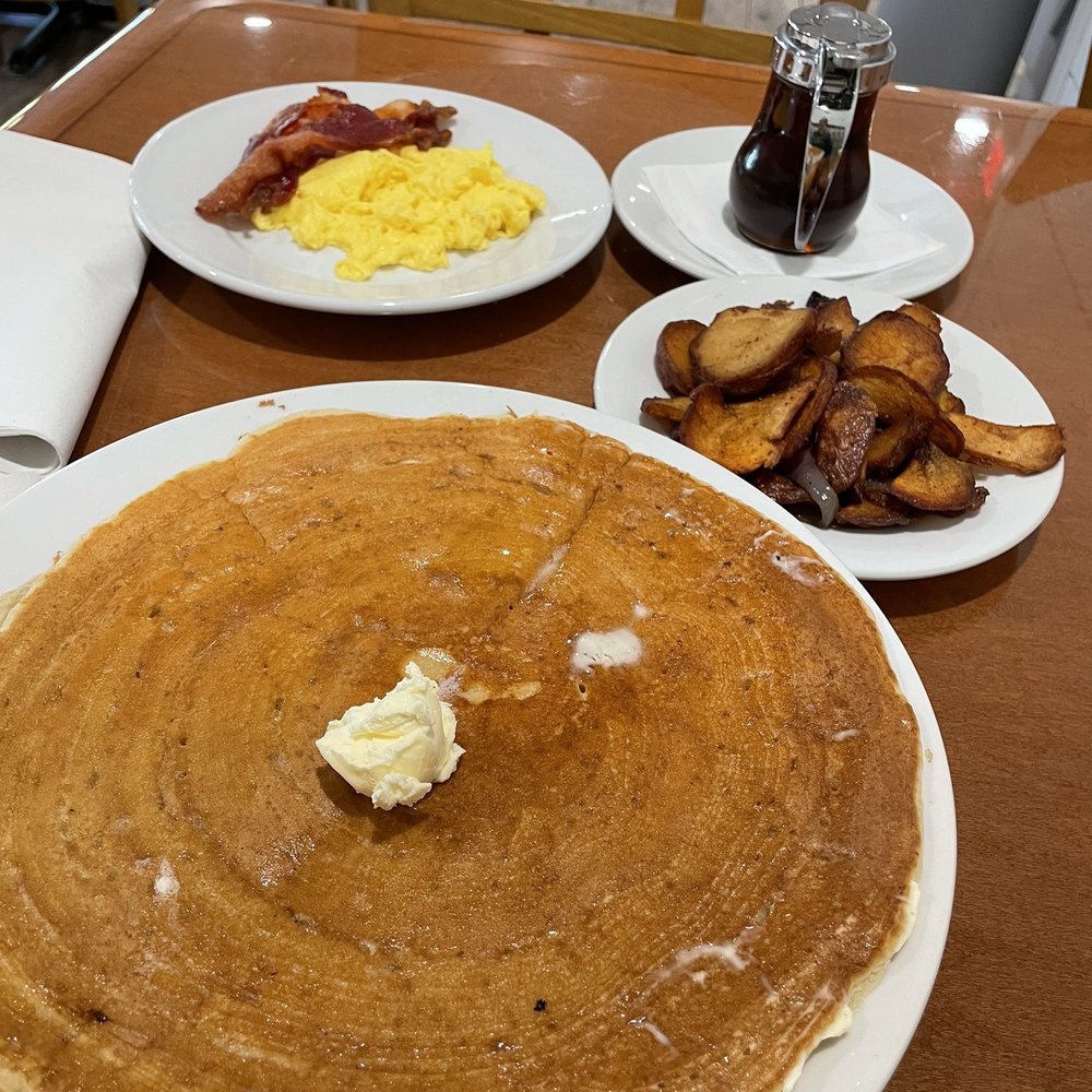 Peach Valley Cafe - Single pancake upgraded to come with bacon and eggs. Home fries on the side - Breakfast & Brunch Near Me - Maitland, Florida Peach Valley Cafe - Single pancake upgraded to come with bacon and eggs. Home fries on the side - Breakfast & Brunch Near Me - Maitland, Florida