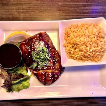 Terry's Terrace - Bourbon Glazed Salmon & Rice w/extra sauce on side - Bars Near Me - Harrison Township, Michigan Terry's Terrace - Bourbon Glazed Salmon & Rice w/extra sauce on side - Bars Near Me - Harrison Township, Michigan