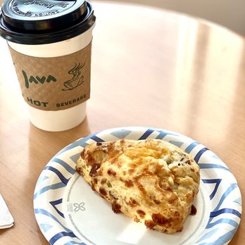 Annelore's German Bakery - a slice of pizza on a plate next to a cup of coffee - Bakeries Near Me - Cary, North Carolina Annelore's German Bakery - a slice of pizza on a plate next to a cup of coffee - Bakeries Near Me - Cary, North Carolina