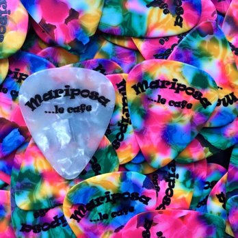Café Mariposa - a guitar pick on a pile of guitar picks - Breakfast & Brunch Near Me - Montreal, Quebec Café Mariposa - a guitar pick on a pile of guitar picks - Breakfast & Brunch Near Me - Montreal, Quebec