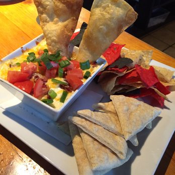 Taps Brewhouse - Bacon artichoke cheese dip appetizer - Pubs Near Me - Niagara Falls, Ontario Taps Brewhouse - Bacon artichoke cheese dip appetizer - Pubs Near Me - Niagara Falls, Ontario