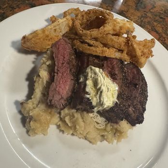 Kool Beanz Cafe - Peppered flank steak, gorgonzola butter, onion rings, mashed potatoes - New American Near Me - Tallahassee, Florida