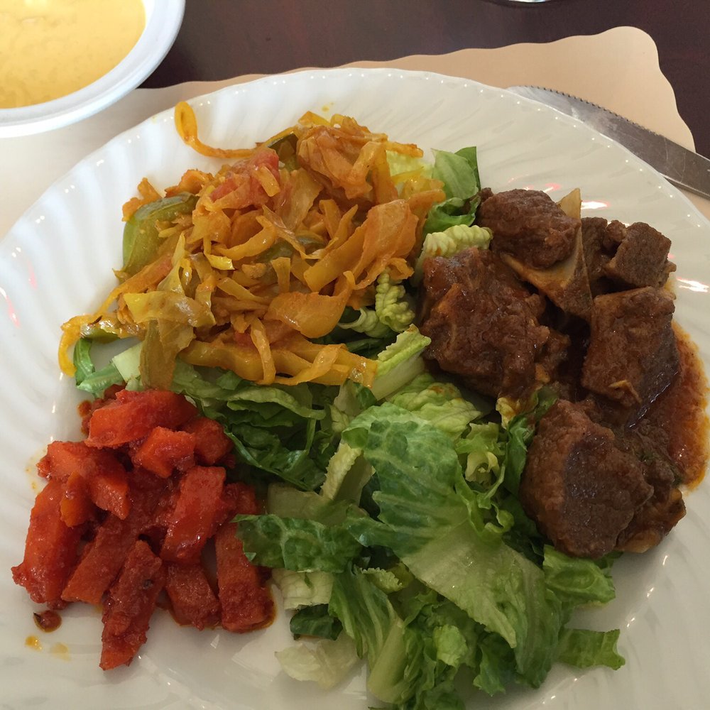 Punjabi Junction - My buffet plate! Some pickles, cabbage and GOAT on a bed of greens! Delicious. - Indian Near Me - Sterling, Virginia Punjabi Junction - My buffet plate! Some pickles, cabbage and GOAT on a bed of greens! Delicious. - Indian Near Me - Sterling, Virginia