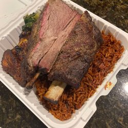 Sentie's Kitchen - The big Nyash (Jollof rice, fried plantain, coleslaw, and smoked beef ribs)