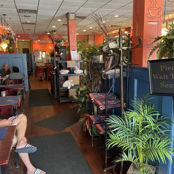 Bernard’s Cafe - a woman sitting on a bench - Diners Near Me - Bernardsville, New Jersey