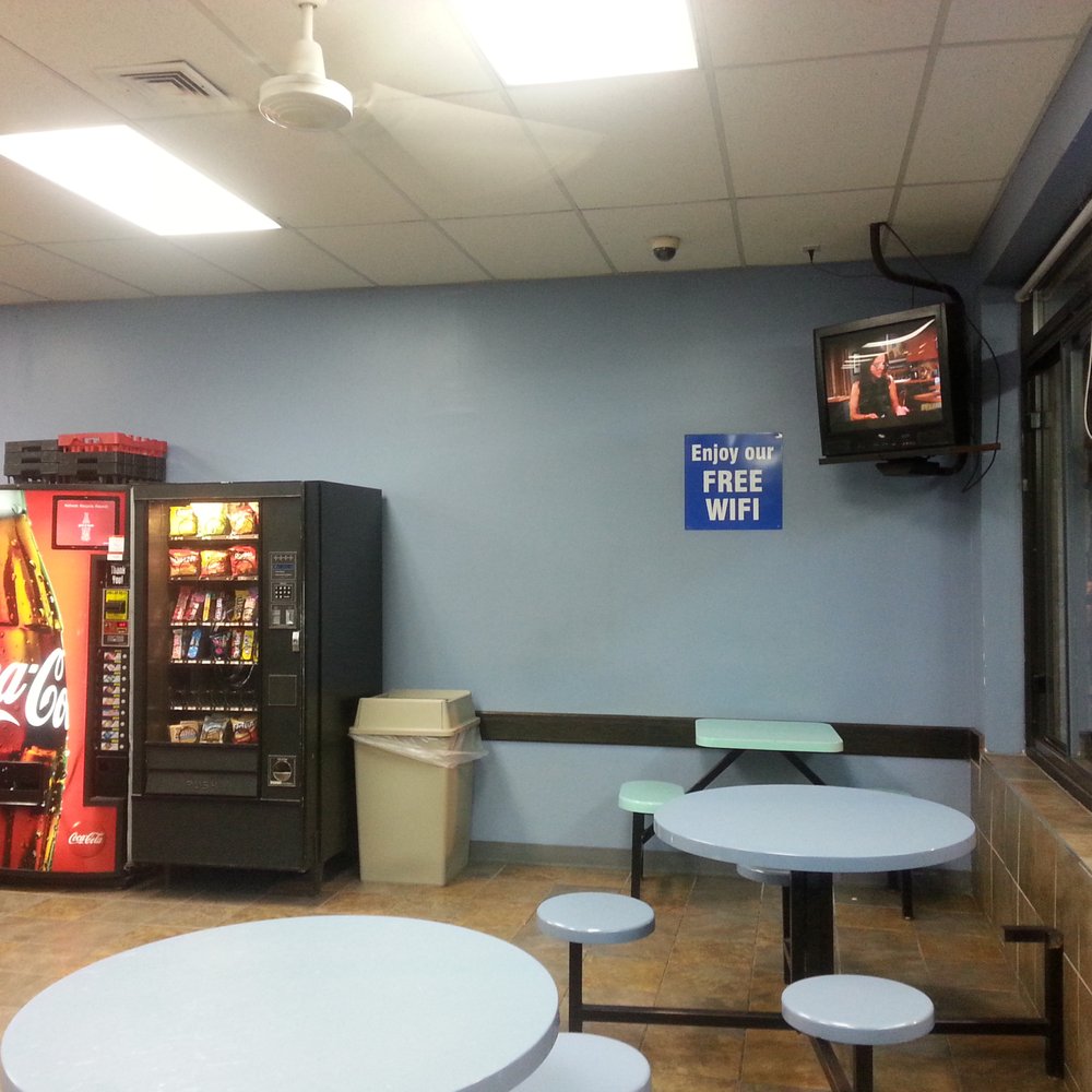 EZ Wash Laundry - Vending machines and TV in sitting area. - Laundry Services Near Me - Buffalo, New York EZ Wash Laundry - Vending machines and TV in sitting area. - Laundry Services Near Me - Buffalo, New York