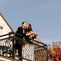Legacy Hill Farm - Legacy Hill Farm Couple on Balcony | Photo Credit: Cameron and Tia Photography