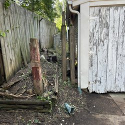 Lawn Sculptors - we cut down all the overgrowth along side the garage on up the side of the house also, even removed all vines growing in the chain link.