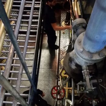 TSS Earnslaw - Crewmember Working in Engine Room - Tours Near Me