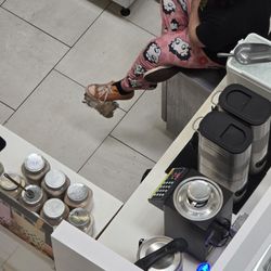 Totally Tea Ingram Park - Dirty shoes and PJs with an employee for Totally Tea sitting on the fridge.
