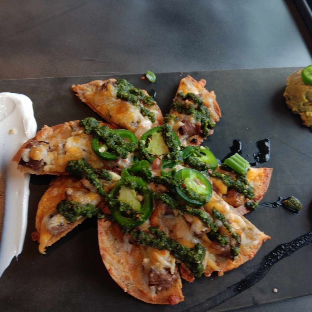 Topgolf - Top Golf's version of Nachos!!! Nachos is not a fancy dish! It's meant to be piled high & deep! WTF is this?!! - Golf Near Me - Independence, Ohio Topgolf - Top Golf's version of Nachos!!! Nachos is not a fancy dish! It's meant to be piled high & deep! WTF is this?!! - Golf Near Me - Independence, Ohio