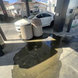 7-Eleven - Throw up or something on ground barely washed by attendants leaving it for all to step in