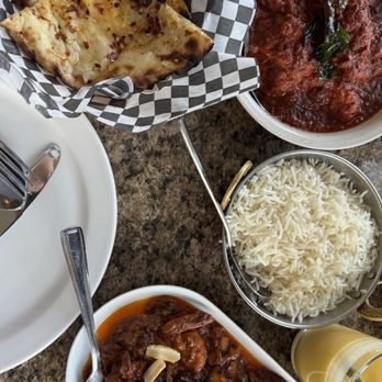 Zyka - Chicken vindaloo, Nadan Chemmeen roast, rice, chili cheese naan - Indian Near Me - Banff, Alberta