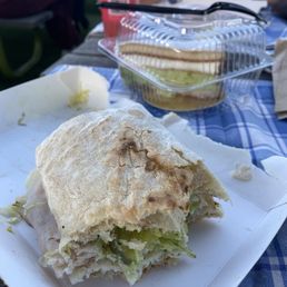 Half a sandwich and pistachio dessert Half a sandwich and pistachio dessert