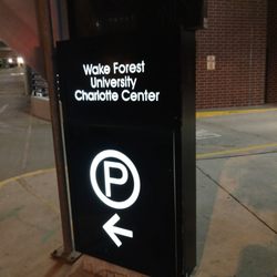 Wake Forest University Charlotte Center Parking - Parking entrance sign on 6th Street