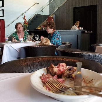 Ruth's Chris Steakhouse - Waitress with the baby while the table in the picture was able to eat. - Steakhouses Near Me - Ann Arbor, Michigan