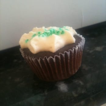 Karma Foods - a chocolate cupcake with frosting and sprinkles - Caterers Near Me