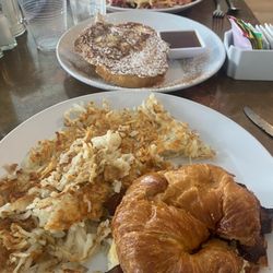 The Cornish Inn - Cornish Quickie with bacon and gouda on croissant and hash browns as the side. Gypsy toast to share! Cornish had with eggs in the back.