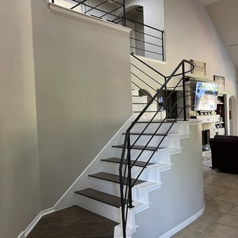 Flooring Warehouse - Laminate stairs with white risers - Flooring Near Me - Cedar Park, Texas Flooring Warehouse - Laminate stairs with white risers - Flooring Near Me - Cedar Park, Texas