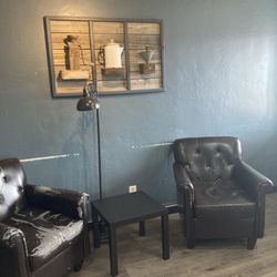 Liberation Coffee Company - Comfy tattered pleather chairs. Farmhouse coffee decor.