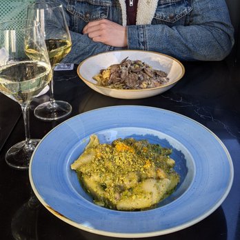 Capocaccia Trattoria - Top: Tagliatelle pasta with truffles/mushrooms Bottom: Shells with shrimp, pesto, pistachio - Pizza Near Me - Toronto, Ontario