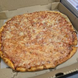 Nonna's Grille - Cheese Pizza. The furthest slices were missing crust.