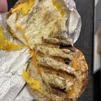 Chick-fil-A - ows a hand holding a half eaten sandwich - Fast Food Near Me - Lincoln University, Pennsylvania Chick-fil-A - ows a hand holding a half eaten sandwich - Fast Food Near Me - Lincoln University, Pennsylvania