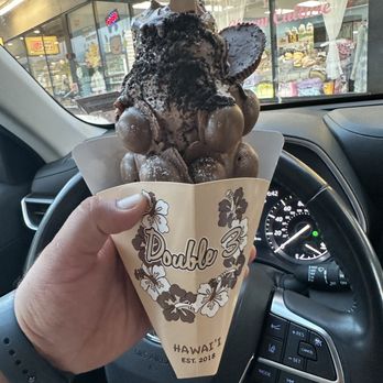 Double Three - Chocolate bubble cone, chocolate ice cream. Topped with chocolate drizzle, peanut butter cup and oreo dust. - Ice Cream & Frozen Yogurt Near Me - Honolulu, Hawaii Double Three - Chocolate bubble cone, chocolate ice cream. Topped with chocolate drizzle, peanut butter cup and oreo dust. - Ice Cream & Frozen Yogurt Near Me - Honolulu, Hawaii