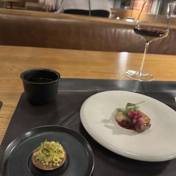 The Wolf's Tailor - That consommé bottom left was perfect for taste. - New American Near Me - Denver, Colorado