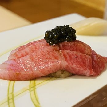 Shihou Omakase - Upper West Side - a close up of a piece of meat on a white plate - Japanese Near Me - New York, New York Shihou Omakase - Upper West Side - a close up of a piece of meat on a white plate - Japanese Near Me - New York, New York