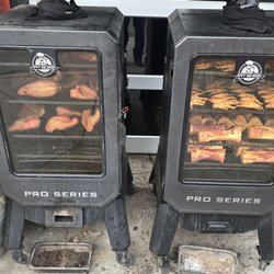 Smokie River Smoked Meats - Smokers cooking away outside the shop.