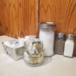 Algonac Flaming Grill - Cream, sugar, butter, S & P on the table. Seems to cover most meals.