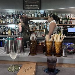 Sit at the bar and you'll get a bartending show too!