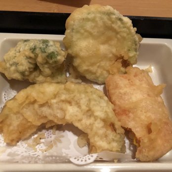 Fuji Sushi - Tempura veggies in bento box (clockwise top left): broccoli, zucchini, sweet potato, & a crescent shaped yellow w/a greenish edible rind. - Japanese Near Me - Jacksonville, Florida Fuji Sushi - Tempura veggies in bento box (clockwise top left): broccoli, zucchini, sweet potato, & a crescent shaped yellow w/a greenish edible rind. - Japanese Near Me - Jacksonville, Florida