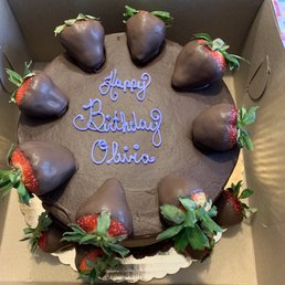 Strawberry cake, chocolate buttercream frosting, and chocolate covered strawberries. Strawberry cake, chocolate buttercream frosting, and chocolate covered strawberries.